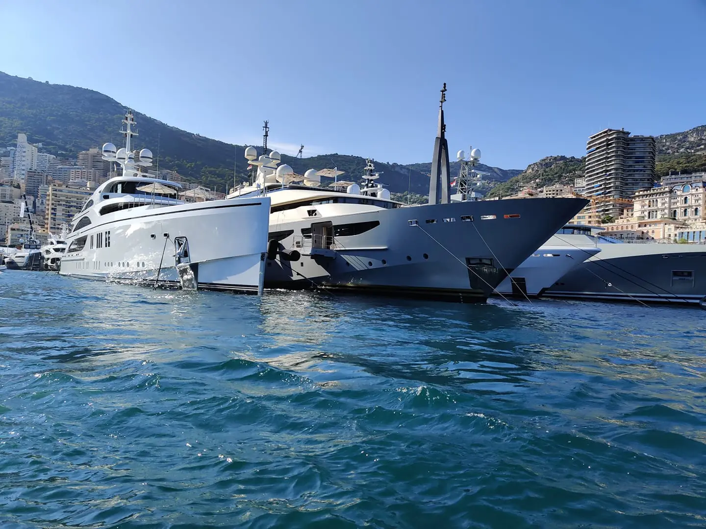 Superyachts moored side by side in a harbour